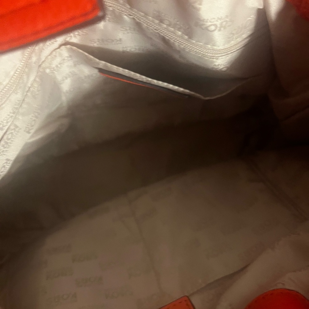 Red trimmed and gold Michael Kors handbag like new